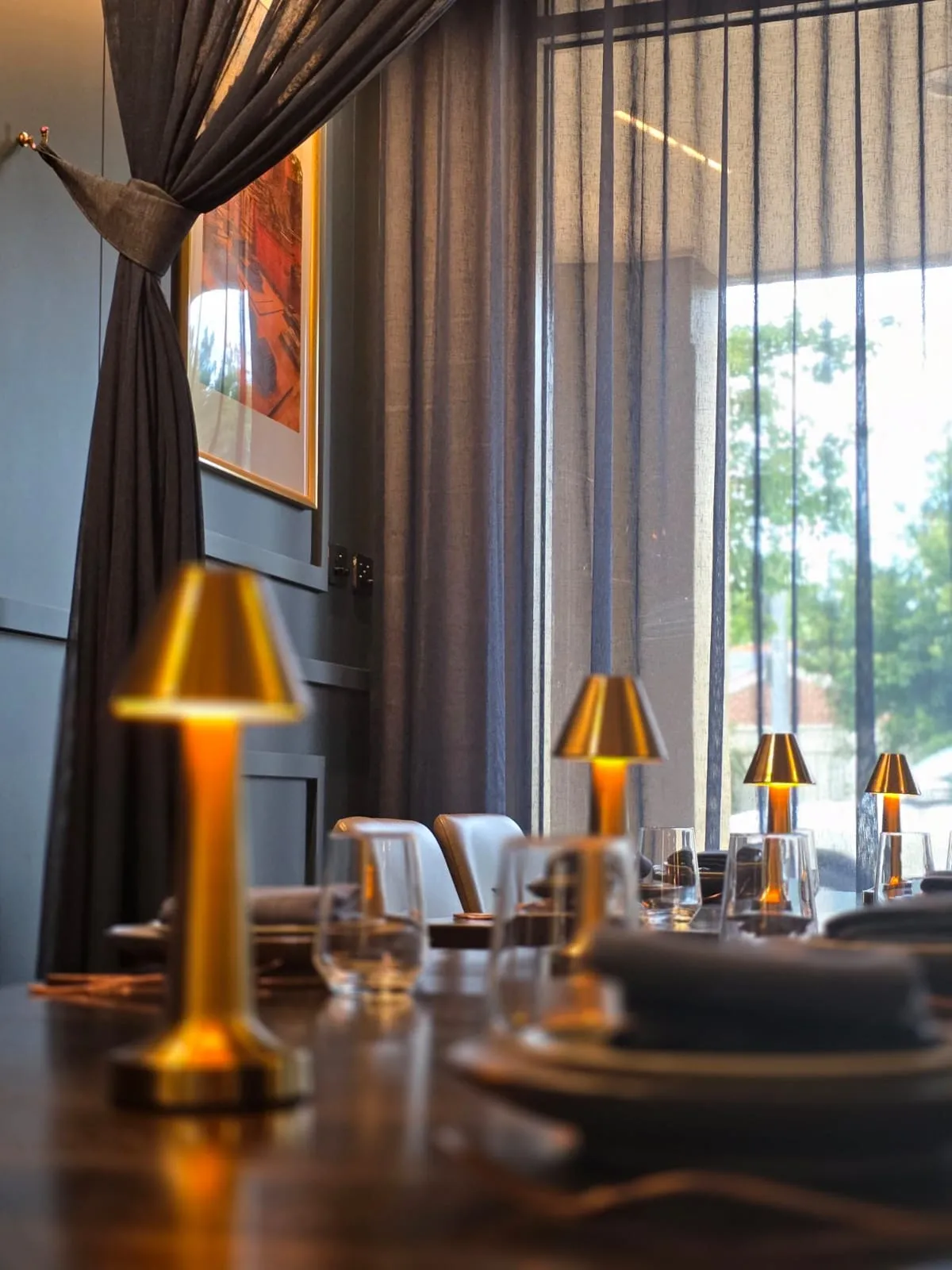 A table laid with glassware